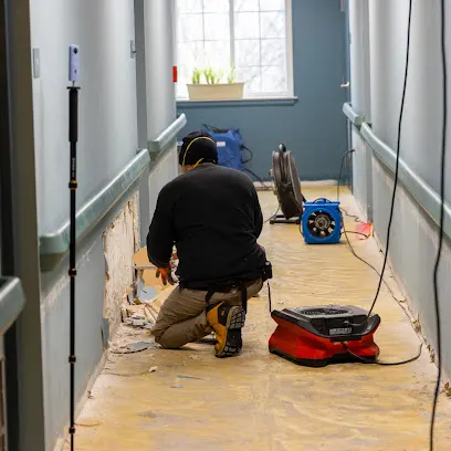 Air movers drying a room after a Stamford, CT water loss