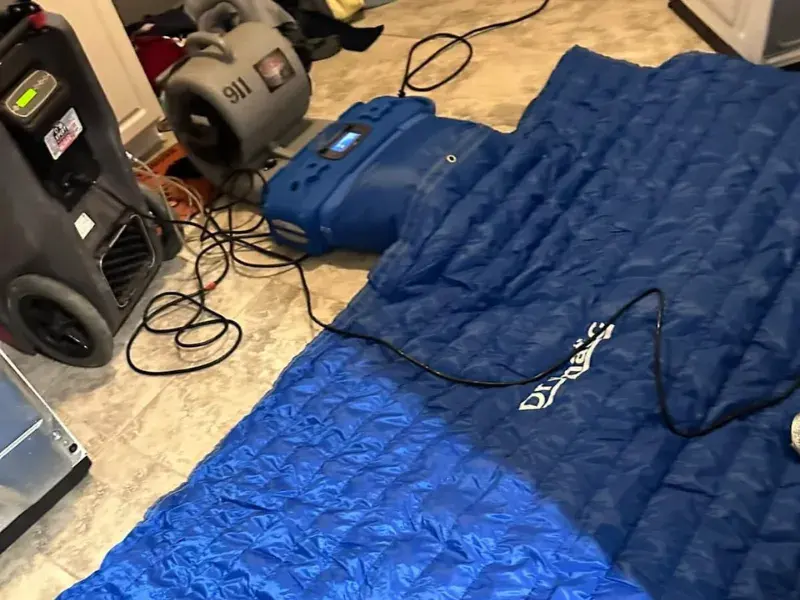 A dehumidifier running during a Stamford, CT dry-out