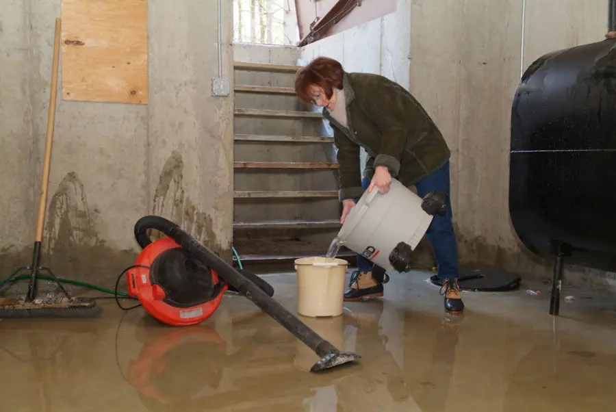 Technician extracting standing water from a Stamford, CT floor